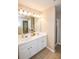 Modern bathroom boasting double sinks, bright lights, and a glass shower at 904 Magnolia Leaf Dr, Woodstock, GA 30188