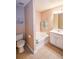 Well-lit bathroom including double sinks, bathtub, and modern fixtures at 904 Magnolia Leaf Dr, Woodstock, GA 30188