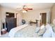 Bedroom showcasing comfortable bedding, a TV, and neutral wall colors at 904 Magnolia Leaf Dr, Woodstock, GA 30188