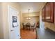 Dining area with stylish light fixture, wood floor and backyard view at 904 Magnolia Leaf Dr, Woodstock, GA 30188