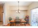 The dining room features a modern chandelier and sliding glass doors at 904 Magnolia Leaf Dr, Woodstock, GA 30188