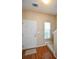 View of the entryway with a white door and a small window at 904 Magnolia Leaf Dr, Woodstock, GA 30188