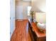 Welcoming foyer with hardwood floors, a display table, and a view of the staircase, offering a warm entry at 904 Magnolia Leaf Dr, Woodstock, GA 30188