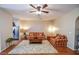 A cozy living room with wood floors, comfortable seating, and natural light creating a warm and inviting atmosphere at 904 Magnolia Leaf Dr, Woodstock, GA 30188