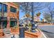 Charming streetscape featuring brick buildings, pedestrian walkways, and decorative lampposts with hanging flower baskets at 904 Magnolia Leaf Dr, Woodstock, GA 30188