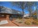 Inviting storefront with brick facade, outdoor seating, and pedestrian-friendly landscaping along a quaint, tree-lined street at 904 Magnolia Leaf Dr, Woodstock, GA 30188