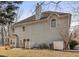 Back of house with a well maintained lawn at 1085 Grace Hadaway Ln, Lawrenceville, GA 30043