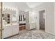 Large bathroom featuring double sinks, a shower, and access to the primary bedroom at 1085 Grace Hadaway Ln, Lawrenceville, GA 30043