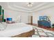 Spacious primary bedroom featuring trey ceilings, wood floors, and a colorful rug at 1085 Grace Hadaway Ln, Lawrenceville, GA 30043