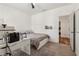 Bedroom featuring a bed, desk, ceiling fan, and wainscotting at 1085 Grace Hadaway Ln, Lawrenceville, GA 30043