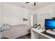 Bedroom featuring a bed, desk, ceiling fan, and wainscotting at 1085 Grace Hadaway Ln, Lawrenceville, GA 30043