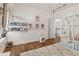 Bright bedroom featuring reading nook, tent bed, playful decor, and hardwood floors at 1085 Grace Hadaway Ln, Lawrenceville, GA 30043