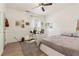 Bedroom featuring a bed, desk, ceiling fan, and wainscotting at 1085 Grace Hadaway Ln, Lawrenceville, GA 30043