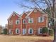 Charming two-story brick home with manicured lawn, classic architectural details, and inviting curb appeal at 1085 Grace Hadaway Ln, Lawrenceville, GA 30043