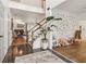Open foyer with view of the staircase and living room, highlighting the bright and airy atmosphere at 1085 Grace Hadaway Ln, Lawrenceville, GA 30043