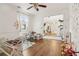 Bright playroom with hardwood floors, sun wall art, and doorway view to additional room at 1085 Grace Hadaway Ln, Lawrenceville, GA 30043