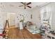 Bright playroom with colorful decor, wood flooring, and a variety of toys and play equipment at 1085 Grace Hadaway Ln, Lawrenceville, GA 30043