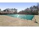 Community pool with a cover during the off-season, clubhouse in the background at 1085 Grace Hadaway Ln, Lawrenceville, GA 30043