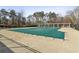 Community pool with a cover during the off-season and a pergola with tables and chairs at 1085 Grace Hadaway Ln, Lawrenceville, GA 30043