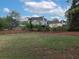 Expansive backyard with newly installed mulch, large grass area and a view of the rear of the house at 1514 Haven Crest Dr, Powder Springs, GA 30127