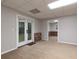 Spacious basement with carpet, a drop ceiling, and glass doors leading to the backyard at 1514 Haven Crest Dr, Powder Springs, GA 30127