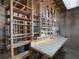 Unfinished basement space showing workbench with wrapping paper storage and shelving at 1514 Haven Crest Dr, Powder Springs, GA 30127