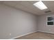 Finished basement with window and neutral carpeting at 1514 Haven Crest Dr, Powder Springs, GA 30127