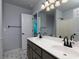 Bathroom featuring a double vanity with updated fixtures and tile flooring at 1514 Haven Crest Dr, Powder Springs, GA 30127