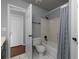 Bathroom with white tile floors, shower and tub, and a neutral-toned shower curtain at 1514 Haven Crest Dr, Powder Springs, GA 30127
