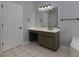 Comfortable bathroom features a single sink vanity, framed mirror and ample lighting at 1514 Haven Crest Dr, Powder Springs, GA 30127