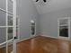 Bright bedroom with hardwood floors and neutral paint at 1514 Haven Crest Dr, Powder Springs, GA 30127