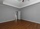 Spacious bedroom boasts hardwood floors, neutral paint, tray ceiling and ample natural light at 1514 Haven Crest Dr, Powder Springs, GA 30127