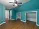 Bedroom with pitched ceiling, hardwood floors, and two closet spaces at 1514 Haven Crest Dr, Powder Springs, GA 30127