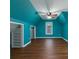 Bedroom with pitched ceiling, hardwood floors, and window at 1514 Haven Crest Dr, Powder Springs, GA 30127