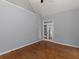 Bedroom with hardwood floors, light-grey walls, and French doors at 1514 Haven Crest Dr, Powder Springs, GA 30127