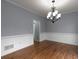 Elegant dining room with hardwood floors and stylish chandelier at 1514 Haven Crest Dr, Powder Springs, GA 30127