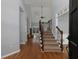Spacious foyer featuring hardwood floors and a staircase with iron railings at 1514 Haven Crest Dr, Powder Springs, GA 30127
