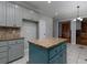 Bright kitchen featuring an island with granite countertop and tile flooring with a view of a fireplace at 1514 Haven Crest Dr, Powder Springs, GA 30127