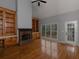 Bright living room with hardwood floors, fireplace, built-in shelves and many windows at 1514 Haven Crest Dr, Powder Springs, GA 30127
