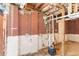 Basement with exposed pipes, cinder block walls, and concrete floor at 1951 Brannen Se Rd, Atlanta, GA 30316