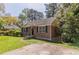 Brick home featuring a quaint front yard and private driveway at 1951 Brannen Se Rd, Atlanta, GA 30316