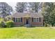 Charming brick home with a well-maintained lawn and traditional landscaping at 1951 Brannen Se Rd, Atlanta, GA 30316