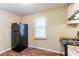 Kitchen featuring black fridge, oven and laminate countertops at 1951 Brannen Se Rd, Atlanta, GA 30316