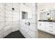 Contemporary bathroom features a large walk-in shower with dual showerheads and sleek fixtures at 2550 Bertrand Way, Cumming, GA 30041
