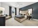 Beautiful bedroom featuring a neutral color palette with a dark accent wall at 2550 Bertrand Way, Cumming, GA 30041