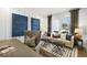 Comfortable sitting area with plush seating, neutral decor, and lots of natural light at 2550 Bertrand Way, Cumming, GA 30041