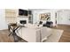 Elegant living room with a cozy fireplace, comfortable seating, and stylish decor at 2550 Bertrand Way, Cumming, GA 30041