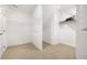 Bright walk-in closet with wire shelving and neutral carpeting at 2550 Bertrand Way, Cumming, GA 30041