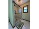 Beautiful bathroom featuring a glass enclosed shower with dark hardware and tiled floor at 321 Roses Creek Dr, Lawrenceville, GA 30044