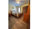 Cozy bedroom with hardwood floors, a comfortable bed, and ample closet space at 321 Roses Creek Dr, Lawrenceville, GA 30044